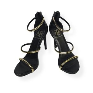 Women's black and gold strappy heels